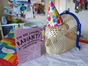 Picture of the mask with a party hat on